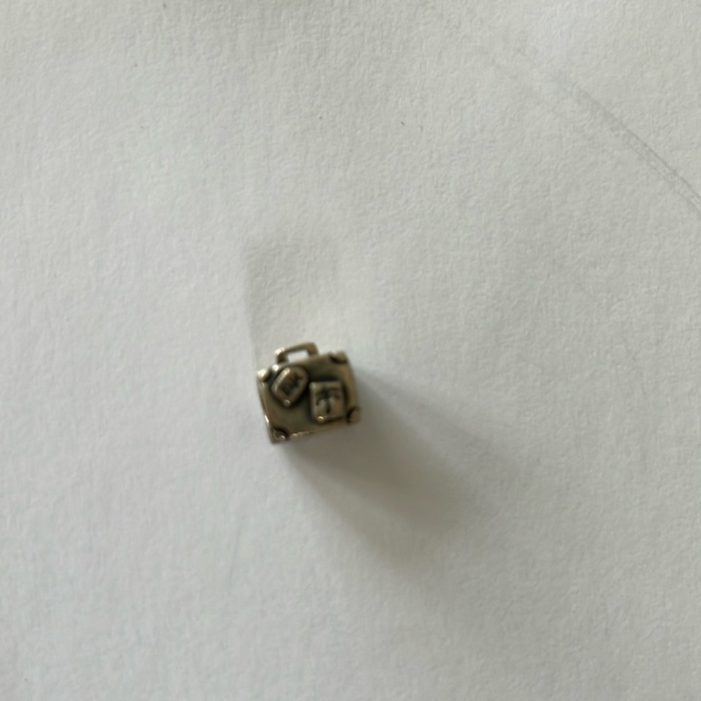 Sterling silver bead suitcase, Paris on one side and a palm tree on the other